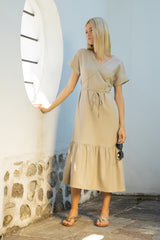 Linen midi dress with a low tiered hem and a tie-around belt